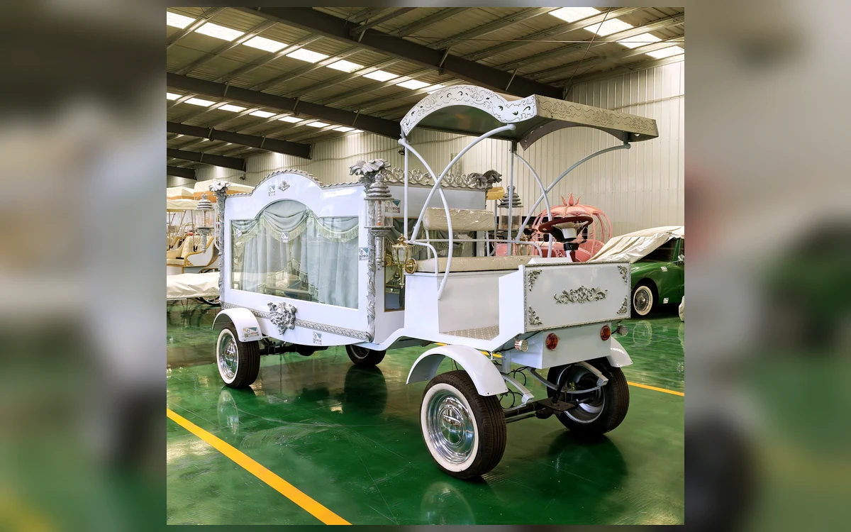 Huajia Royal Funeral Coach - Funeral Coach by Huajia Machinery. The Huajia Royal Funeral Coach is a white ceremonial hearse carriage designed for memorial services, angle 3