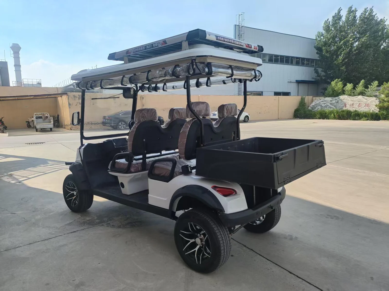Huajia White Cargo Golf Cart - Cargo Golf Cart by Huajia Machinery. The Huajia White Cargo Golf Cart combines an open one-row driving compartment wi