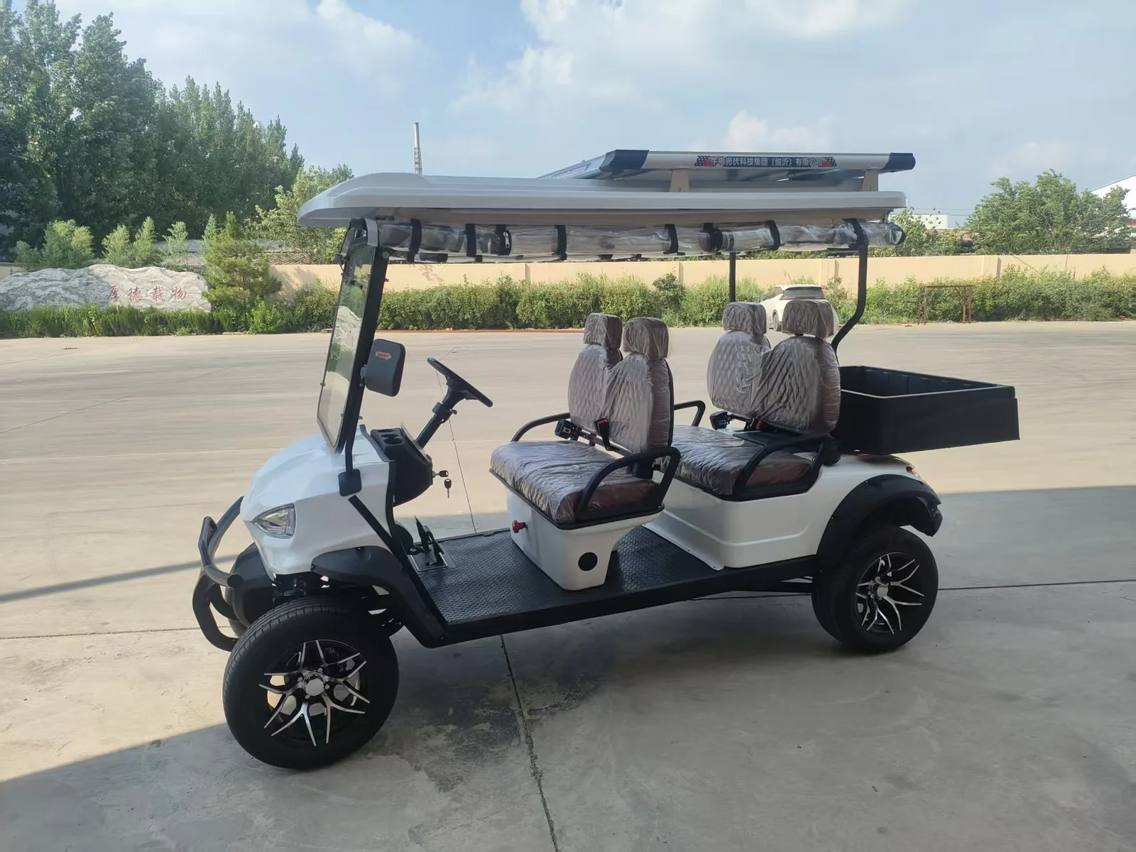 Huajia White Cargo Golf Cart - Cargo Golf Cart by Huajia Machinery. The Huajia White Cargo Golf Cart combines an open one-row driving compartment with a fixed rear carg angle 2