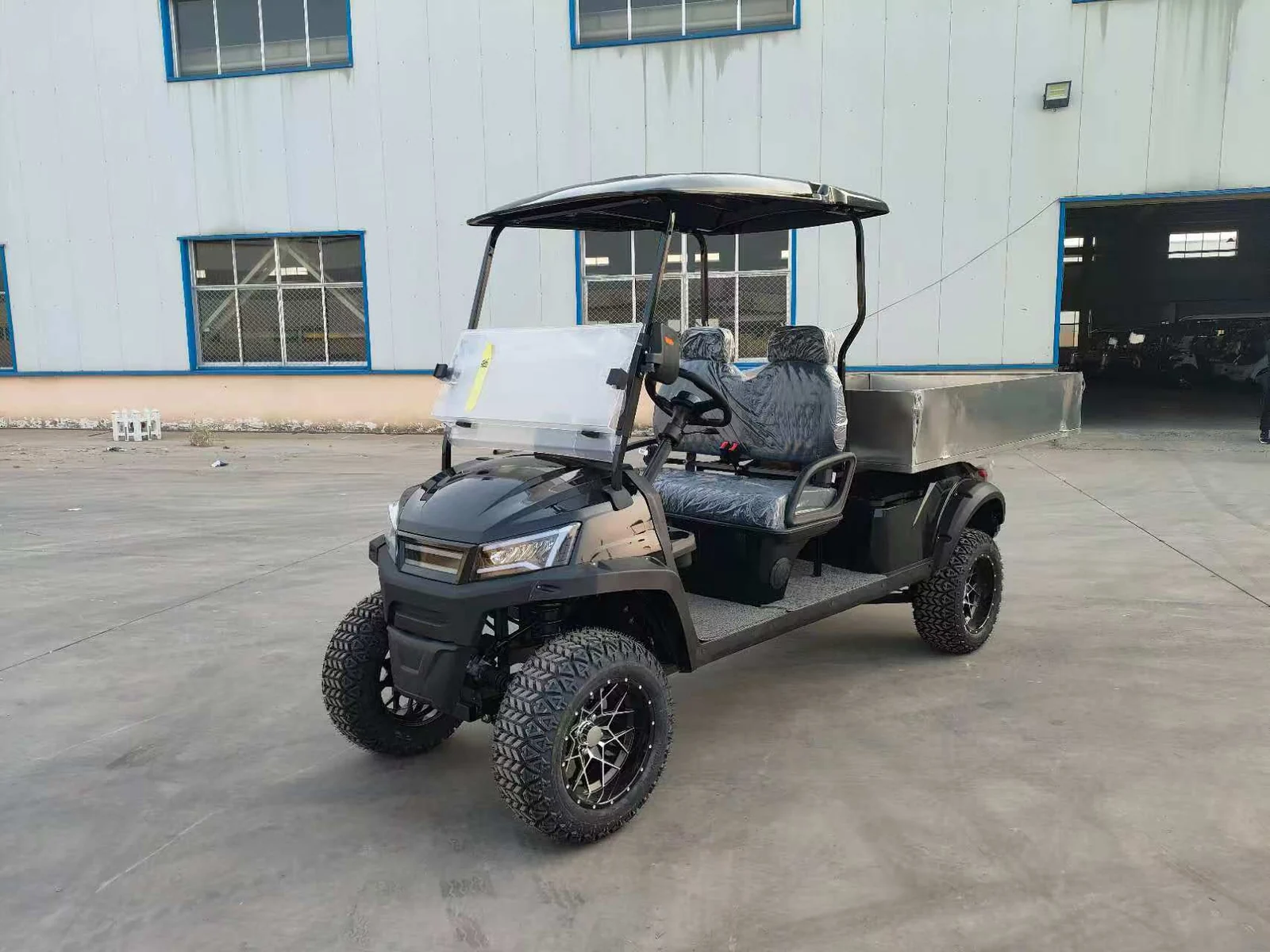 Huajia White Cargo Golf Cart - Cargo Golf Cart by Huajia Machinery. The Huajia White Cargo Golf Cart combines an open one-row driving compartment with a fixed rear carg angle 3
