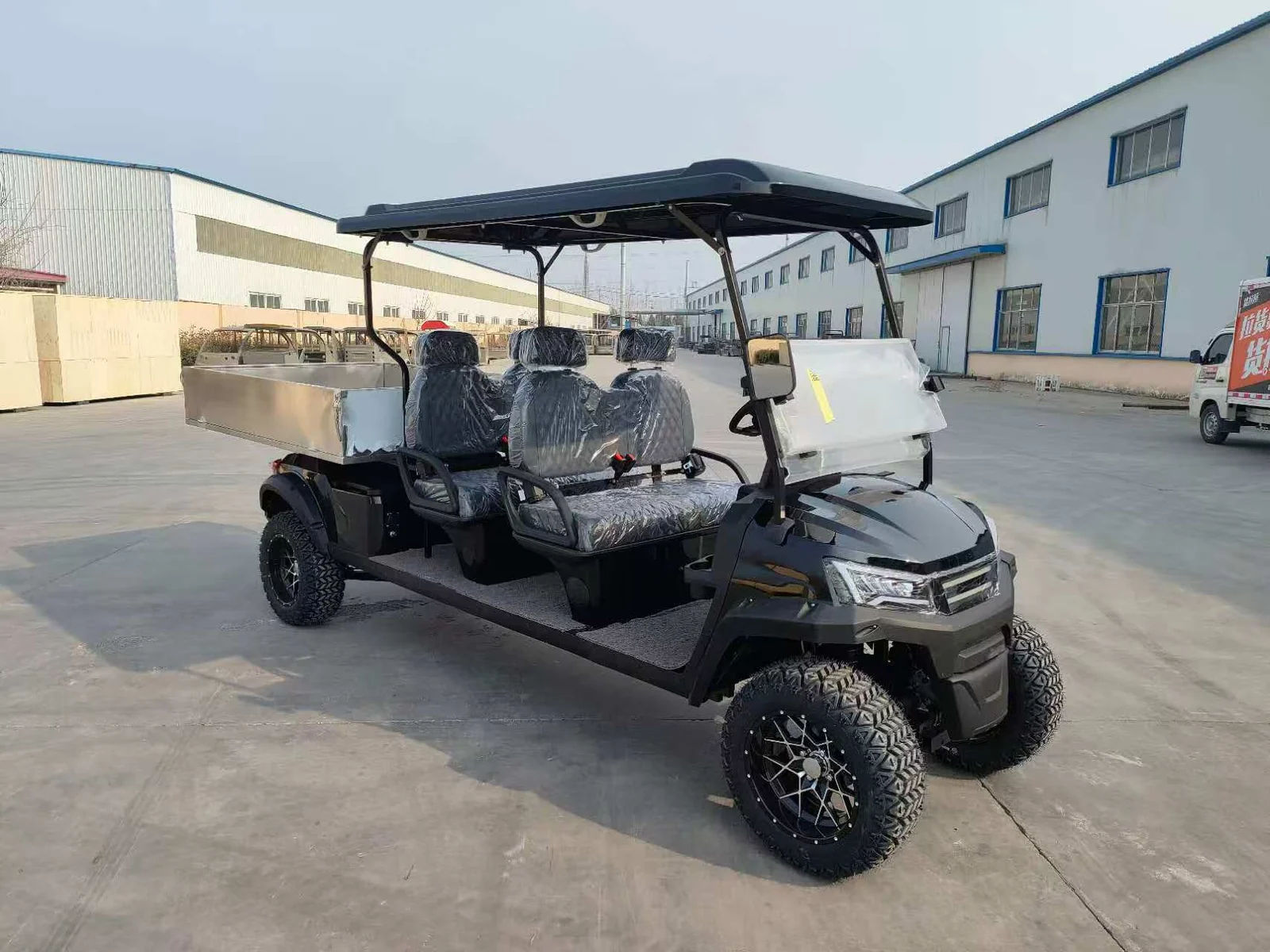 Huajia White Cargo Golf Cart - Cargo Golf Cart by Huajia Machinery. The Huajia White Cargo Golf Cart combines an open one-row driving compartment with a fixed rear carg angle 5